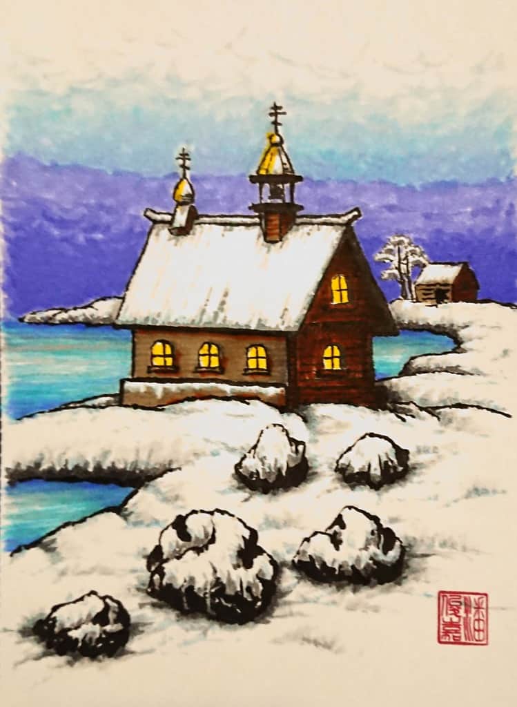 Orthodox chapel across the lake in the deep blue winter